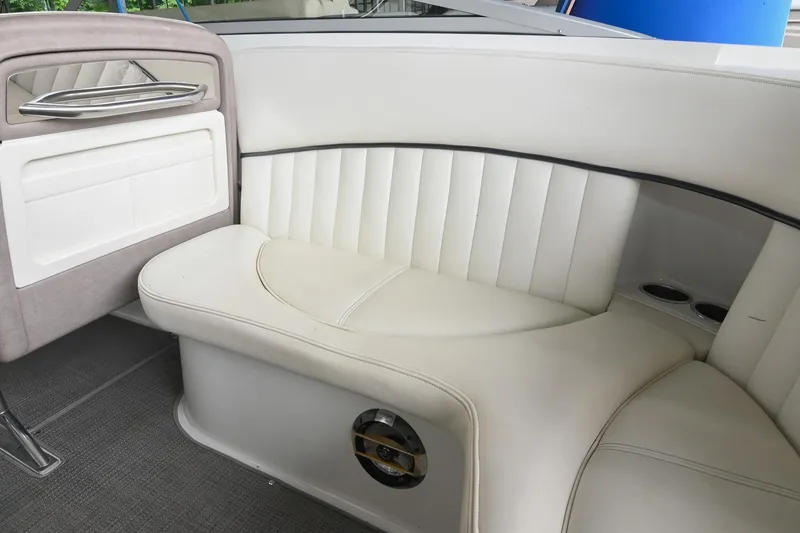 Slide: The Image of Luxurious white seating in a 2005 Cobalt 262 boat interior. - 22