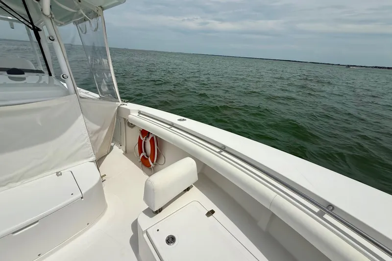 Slide: The Image of 2017 Southport 33 FE boat on open water under a clear sky. - 16