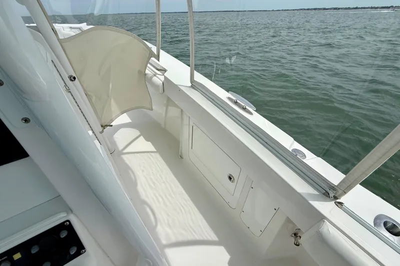 Slide: The Image of Anchor compartment of 2017 Southport 33 FE boat with chain and tools. - 23