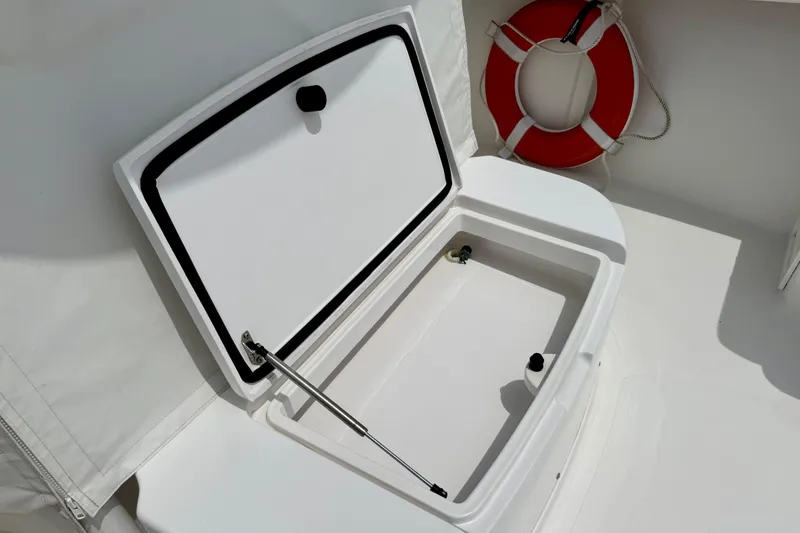 Slide: The Image of 2017 Southport 33 FE boat on open water, featuring a sleek white design and spacious deck. - 26