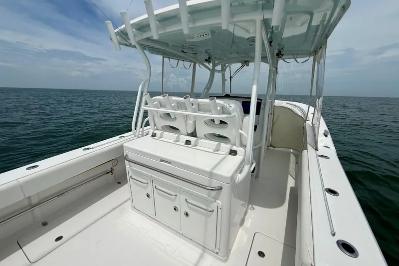 Slide: The Image of Open storage compartment on 2017 Southport 33 FE boat with cleaning supplies. - 28
