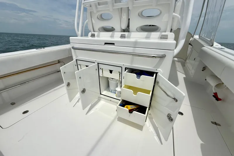 Slide: The Image of 2017 Southport 33 FE boat helm with rod holders and ocean view. - 30