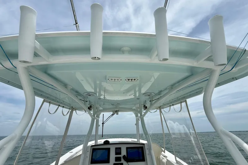 Slide: The Image of 2017 Southport 33 FE boat with open storage compartment and Suzuki 300 engines. - 31