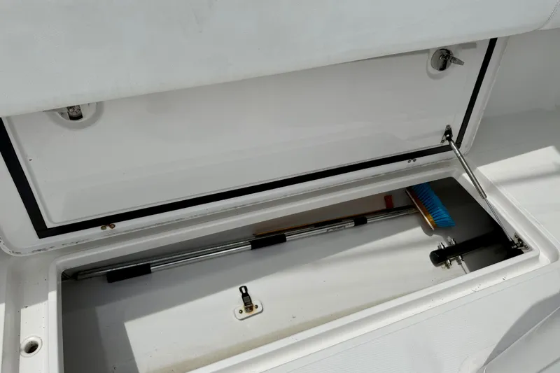 Slide: The Image of Open storage compartment on a 2017 Southport 33 FE boat. - 33