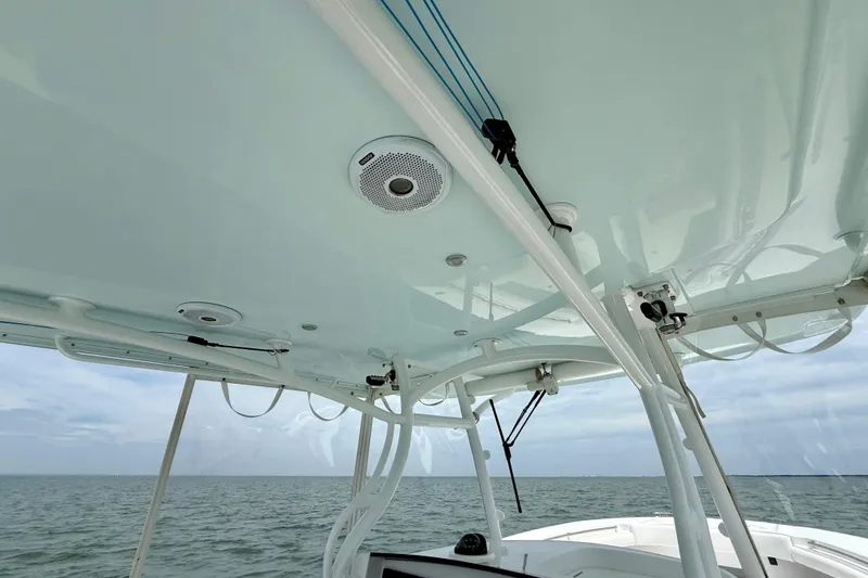 Slide: The Image of 2017 Southport 33 FE boat with white cushioned seats and ocean view. - 40