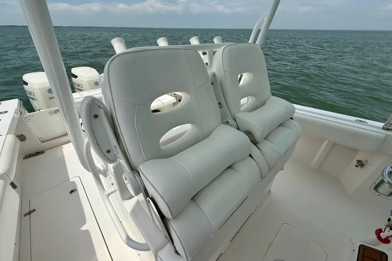 Slide: The Image of 2017 Southport 33 FE boat interior with steering wheel and stainless steel compartment. - 42