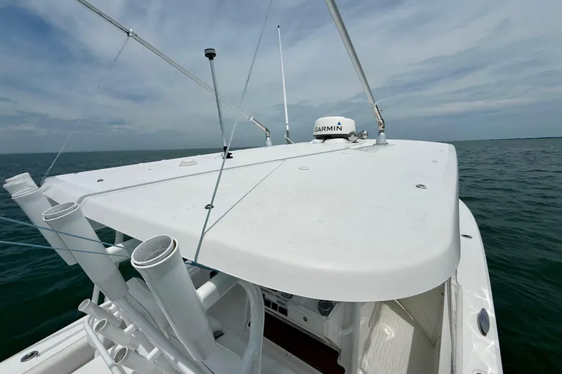 Slide: The Image of Storage compartment on a 2017 Southport 33 FE boat with safety equipment and tools. - 47