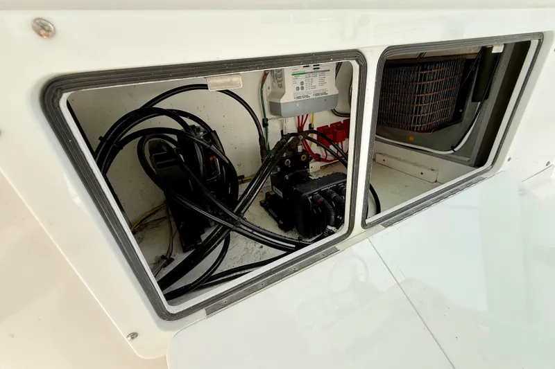 Slide: The Image of Open drawer on 2017 Southport 33 FE boat, containing various small items and tools. - 51