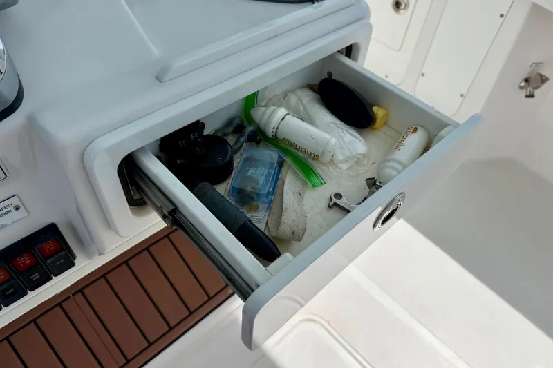 Slide: The Image of 2017 Southport 33 FE boat interior with sink, control panel, and countertop. - 52