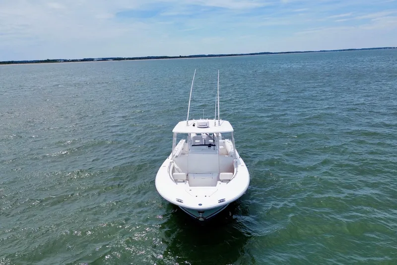 Slide: The Image of Overhead view of 2017 Southport 33 FE boat on green water. - 7