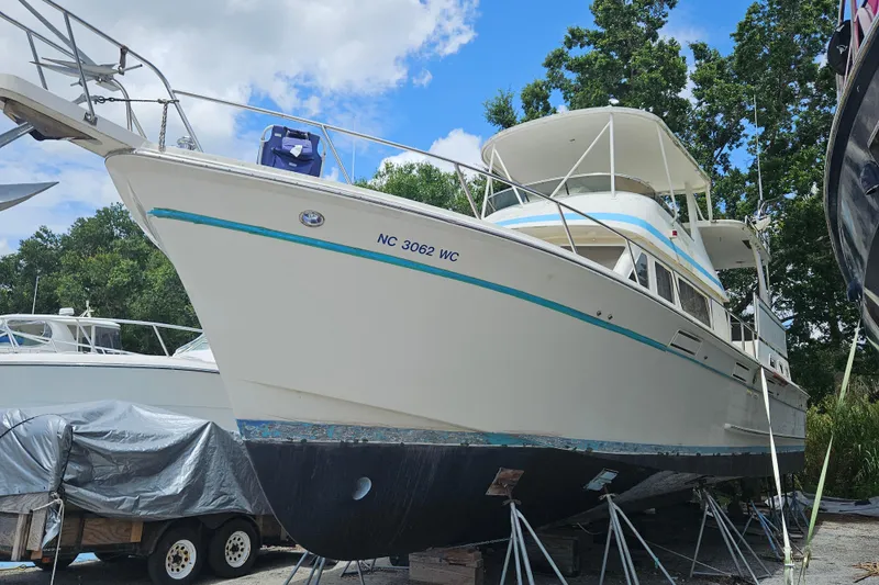 Slide: The Image of 1991 Offshore Yachts 48 Yachtfisher on stands, ready for maintenance under a clear sky. - 5