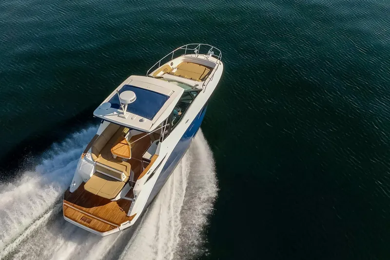 Slide: The Image of 2020 Sea Ray Sundancer 320 Coupe cruising on open water. - 13
