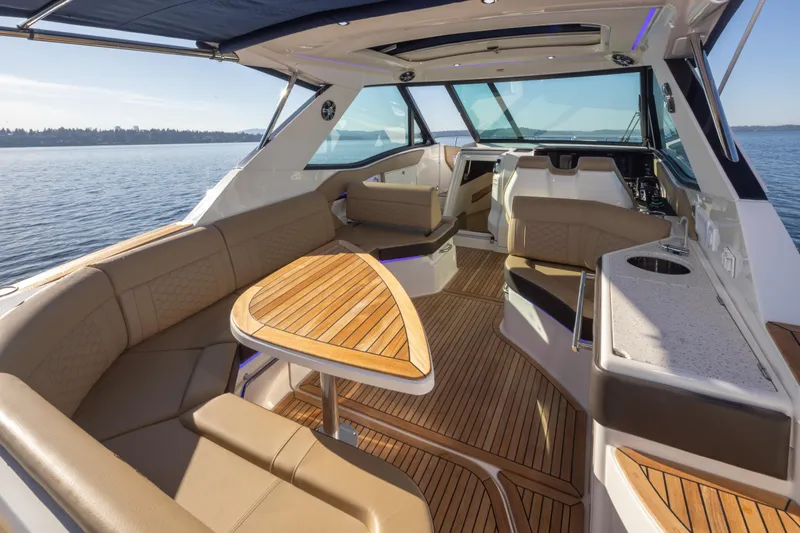 Slide: The Image of Luxurious interior of 2020 Sea Ray Sundancer 320 Coupe with elegant seating and wooden accents. - 19