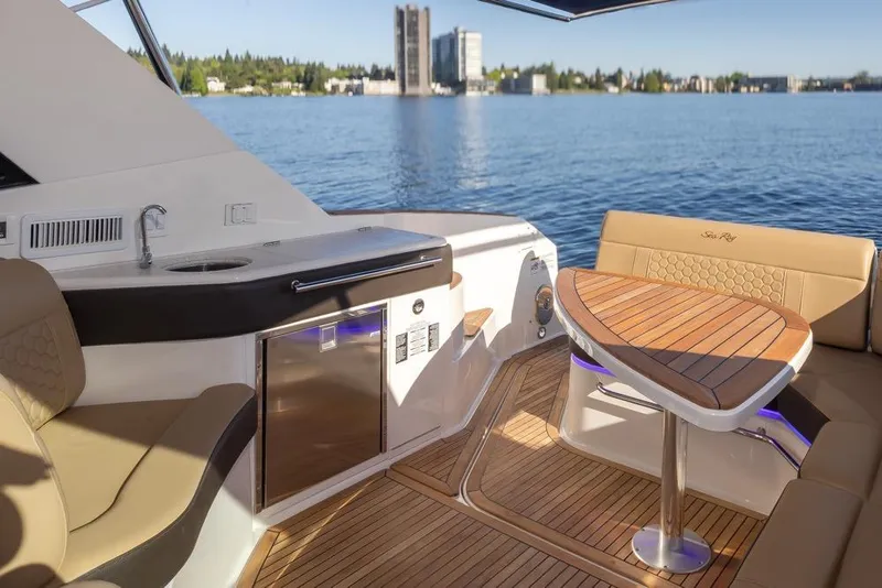Slide: The Image of Luxurious 2020 Sea Ray Sundancer 320 Coupe yacht interior with elegant seating and scenic water view. - 21