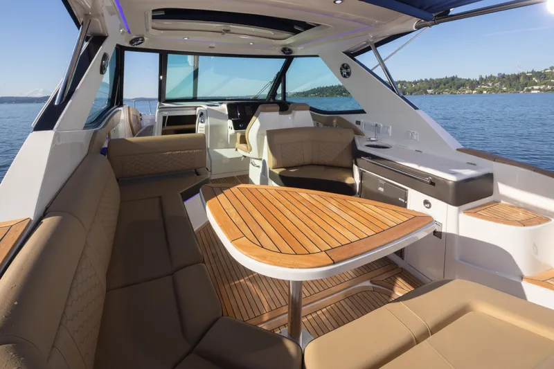 Slide: The Image of Luxurious interior of 2020 Sea Ray Sundancer 320 Coupe with elegant seating and wooden table. - 22