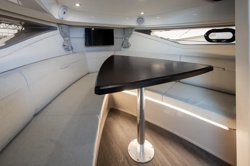 Slide: The Image of Interior of 2020 Sea Ray Sundancer 320 Coupe with sleek dining area and modern design. - 27