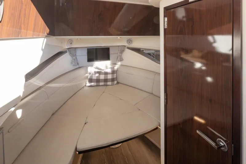 Slide: The Image of Interior cabin of 2020 Sea Ray Sundancer 320 Coupe with cozy seating and modern decor. - 29