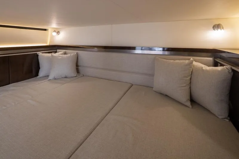 Slide: The Image of Luxurious interior cabin of 2020 Sea Ray Sundancer 320 Coupe with plush bedding. - 31