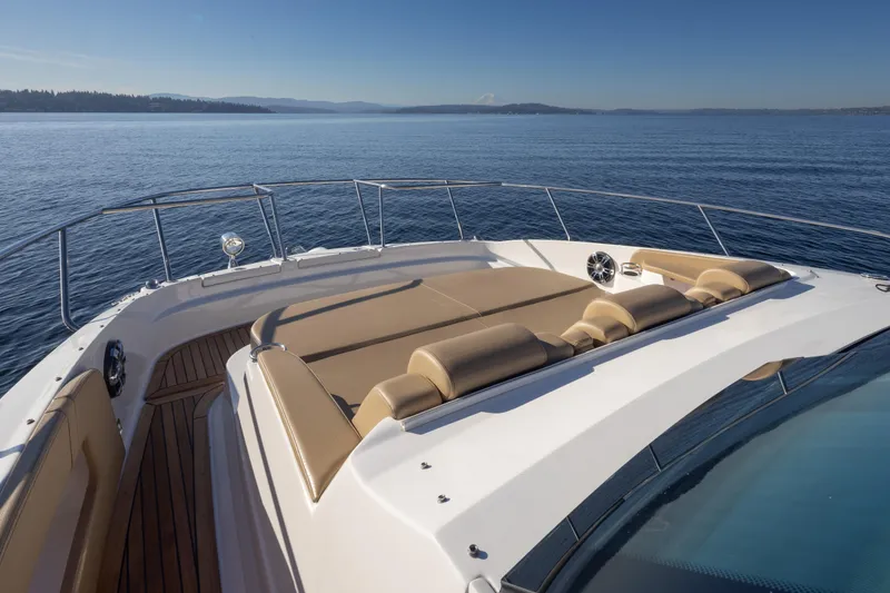 Slide: The Image of 2020 Sea Ray Sundancer 320 Coupe yacht with spacious sun deck on calm waters. - 33