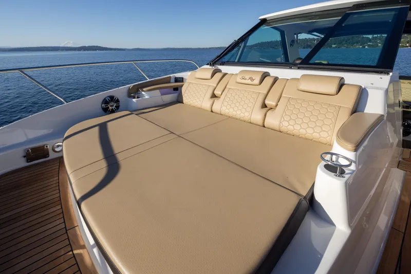 Slide: The Image of Luxurious 2020 Sea Ray Sundancer 320 Coupe with spacious sunbed on deck, overlooking serene waters. - 34