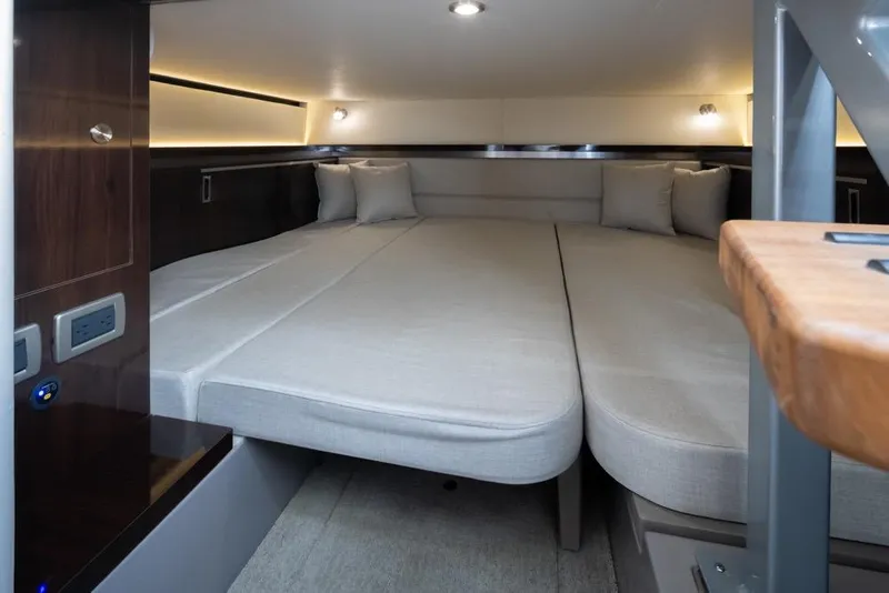 Slide: The Image of Interior cabin of 2020 Sea Ray Sundancer 320 Coupe with modern bedding and lighting. - 38