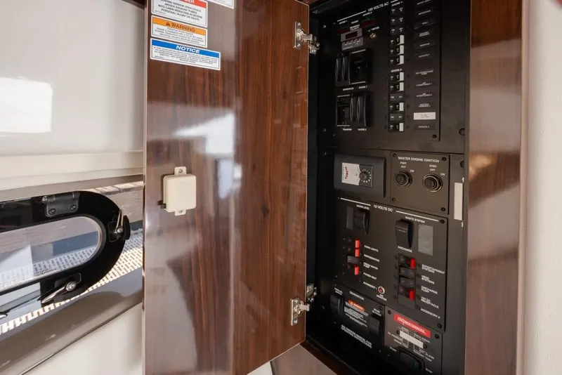 Slide: The Image of Electrical panel inside 2020 Sea Ray Sundancer 320 Coupe yacht, featuring switches and controls. - 40
