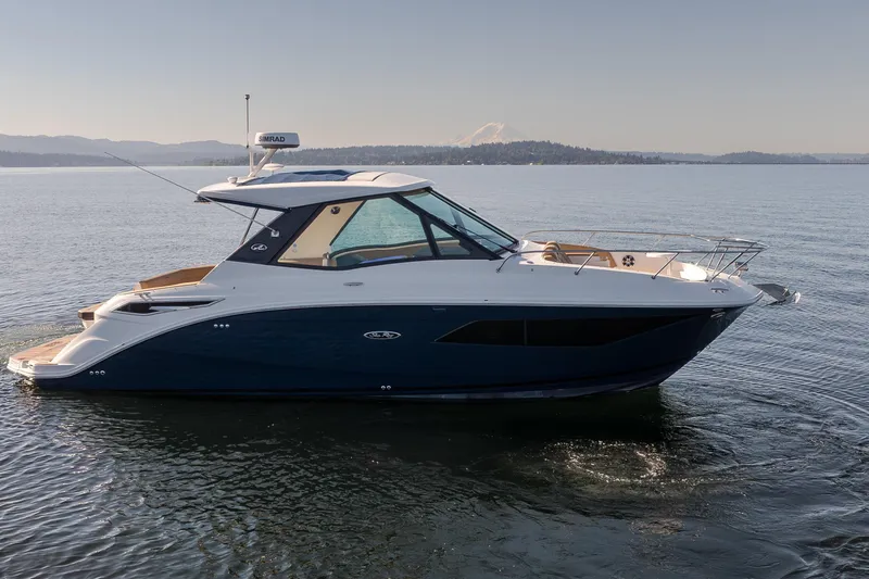 Slide: The Image of 2020 Sea Ray Sundancer 320 Coupe cruising on calm waters. - 5