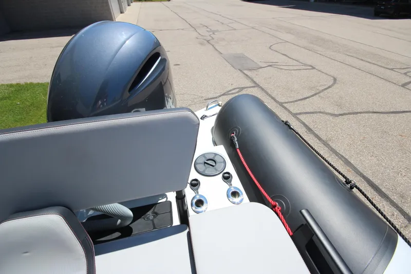 Slide: The Image of 2020 Zodiac Open 6.5 boat interior with engine and seating detail. - 10