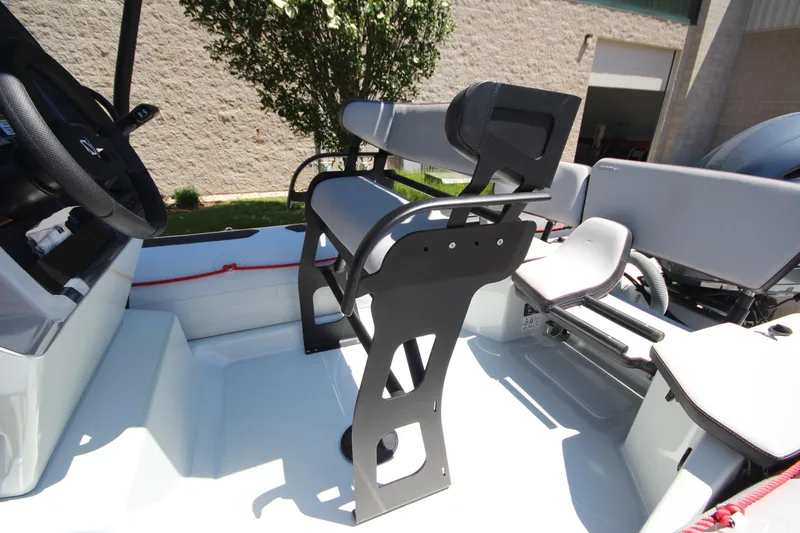 Slide: The Image of 2020 Zodiac Open 6.5 boat interior with seating and steering wheel. - 12