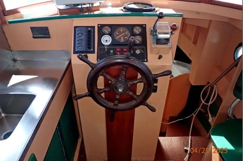 Slide: The Image of 1961 William Garden Custom boat helm with wooden wheel and control panel. - 5