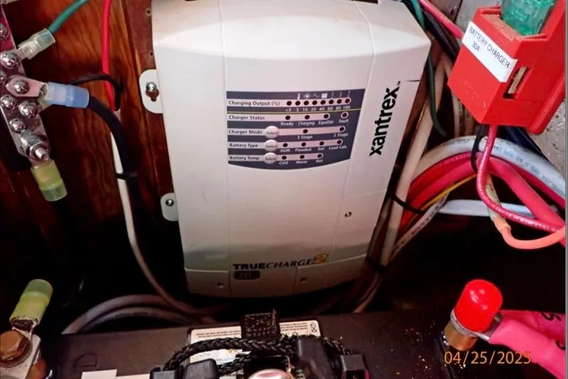 Slide: The Image of Battery charger setup in a 1961 William Garden Custom boat, featuring Xantrex TrueCharge2. - 7