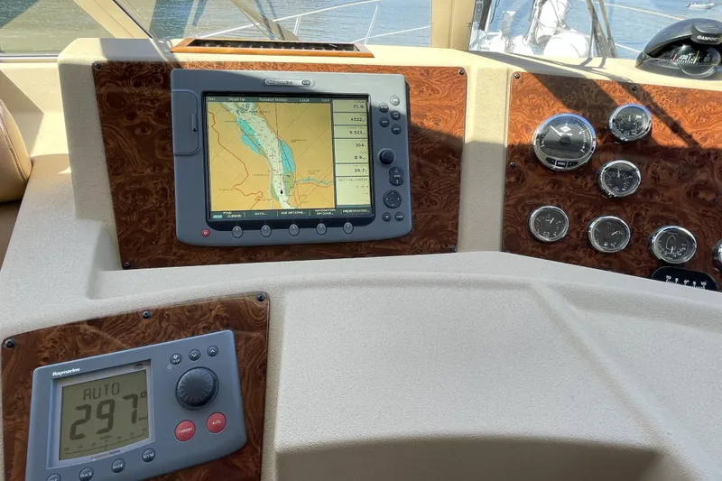 Slide: The Image of Dashboard of a 2008 Meridian 490 Pilothouse with navigation and control instruments. - 12