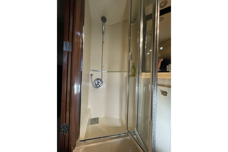 Slide: The Image of Shower area inside 2008 Meridian 490 Pilothouse yacht, featuring glass door and modern fixtures. - 15