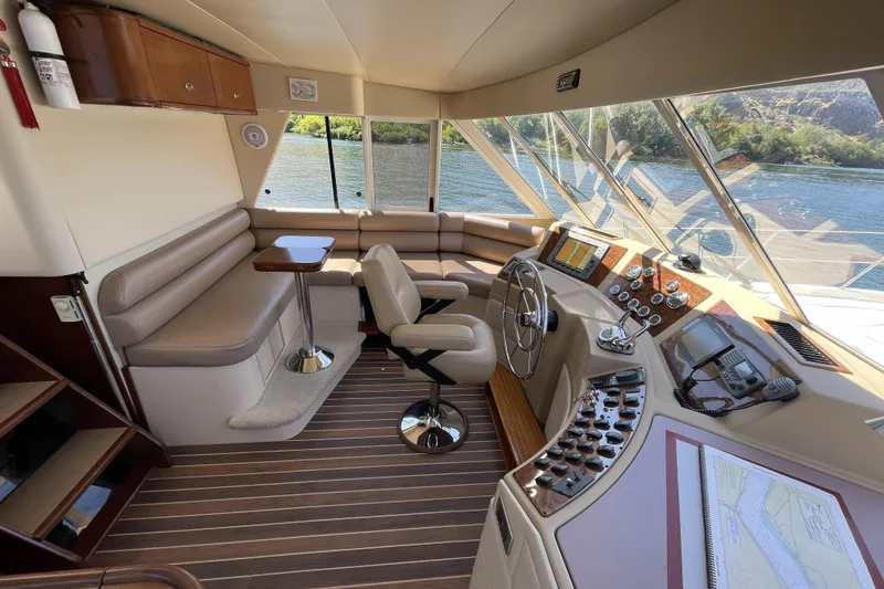 Slide: The Image of Luxurious 2008 Meridian 490 Pilothouse interior with helm, seating, and navigation equipment. - 16
