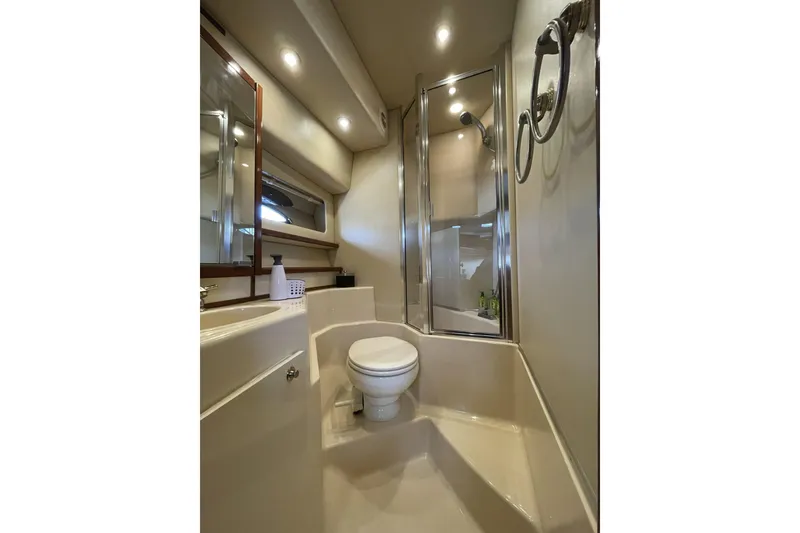 Slide: The Image of Bathroom interior of 2008 Meridian 490 Pilothouse yacht, featuring shower and toilet. - 21