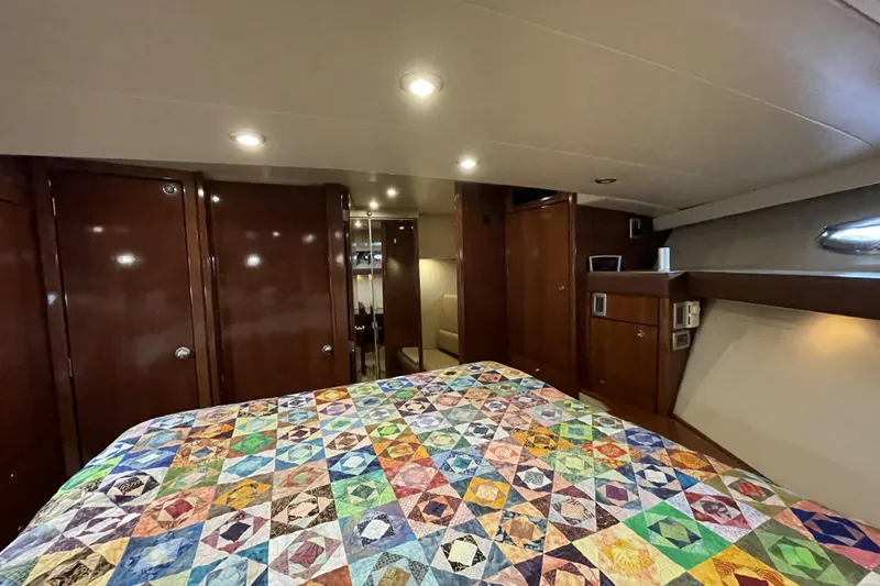 Slide: The Image of Luxurious cabin interior of 2008 Meridian 490 Pilothouse with colorful quilted bedspread. - 23