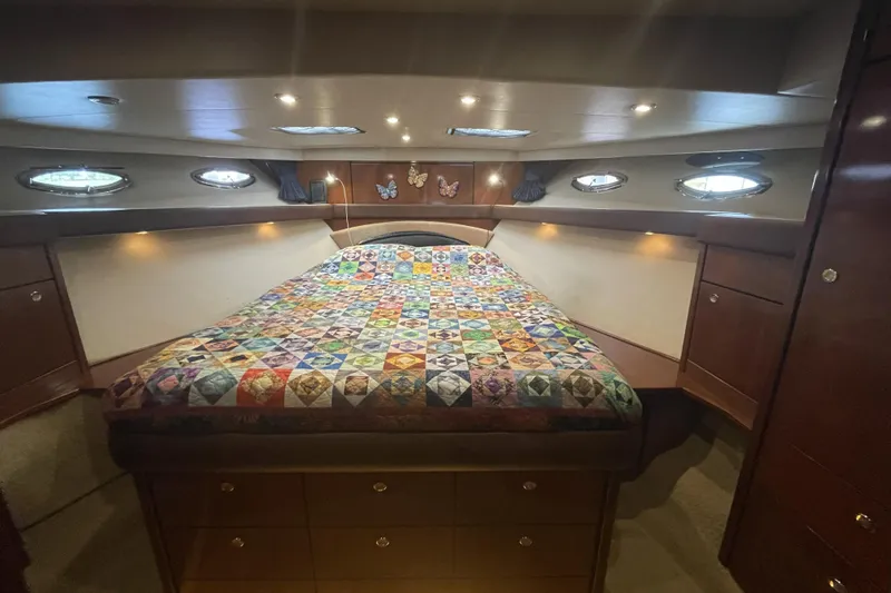 Slide: The Image of Luxurious 2008 Meridian 490 Pilothouse cabin with colorful quilt and elegant wood finish. - 27