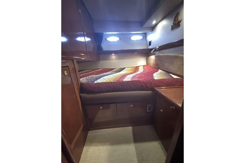 Slide: The Image of Luxurious cabin interior of 2008 Meridian 490 Pilothouse yacht with cozy bed and wood finish. - 28
