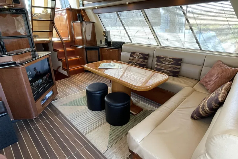 Slide: The Image of Luxurious interior of a 2008 Meridian 490 Pilothouse yacht with elegant seating and wooden finishes. - 3