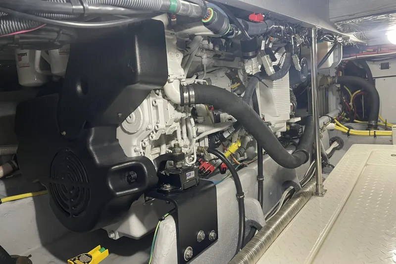 Slide: The Image of Engine room of a 2008 Meridian 490 Pilothouse yacht, showcasing detailed mechanical components. - 30