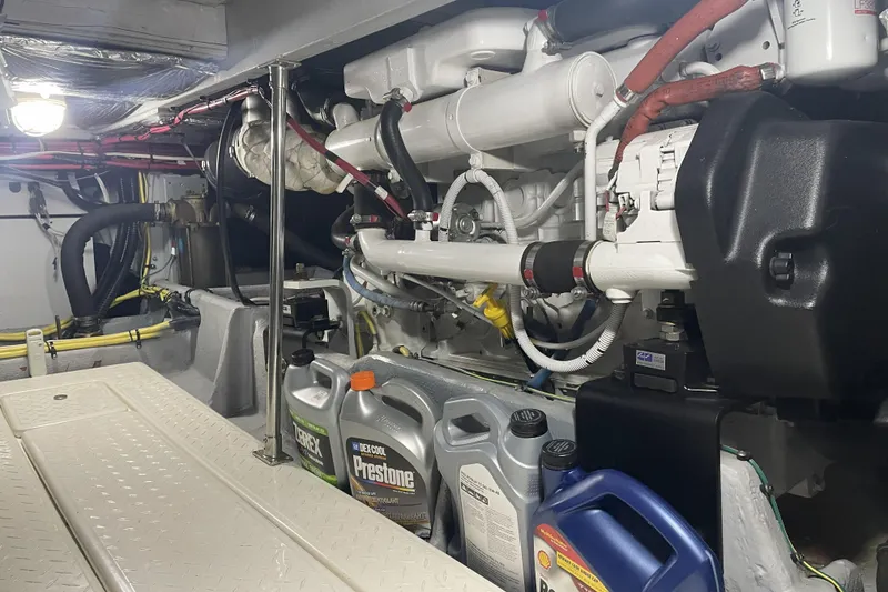 Slide: The Image of Engine room of a 2008 Meridian 490 Pilothouse with maintenance supplies and components. - 31
