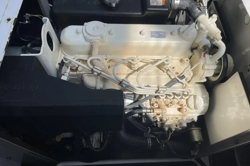 Slide: The Image of Engine compartment of a 2008 Meridian 490 Pilothouse boat, showcasing mechanical components. - 32