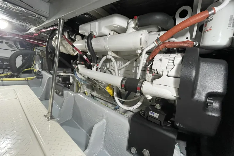 Slide: The Image of Engine room of a 2008 Meridian 490 Pilothouse yacht, showcasing mechanical components. - 35