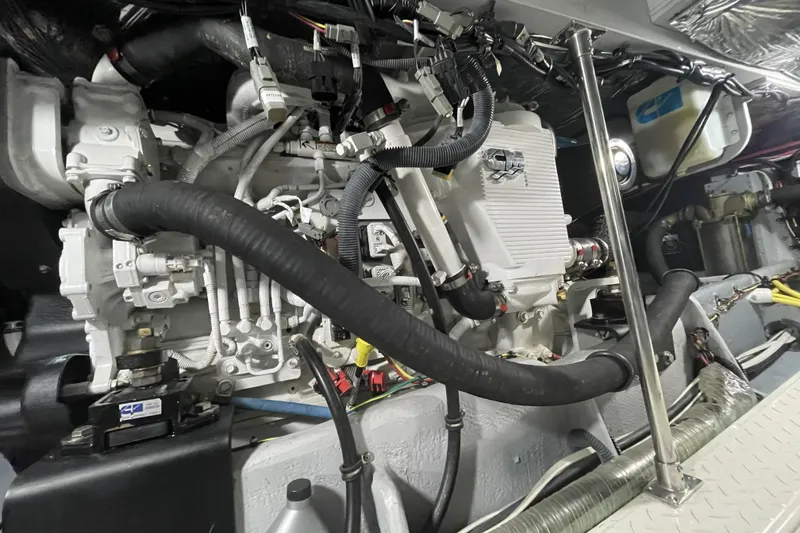 Slide: The Image of Engine room of a 2008 Meridian 490 Pilothouse yacht, showcasing mechanical components. - 36