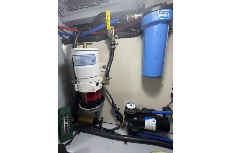 Slide: The Image of Engine room of 2008 Meridian 490 Pilothouse with fuel filter and water separator system. - 39