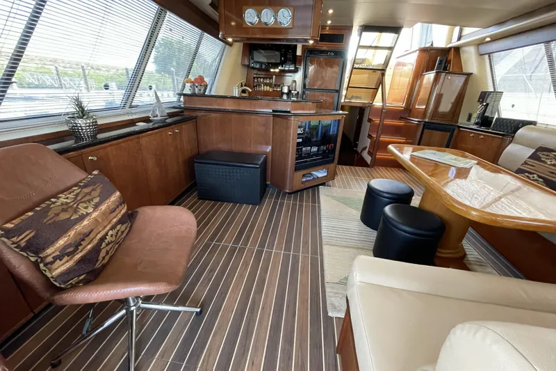 Slide: The Image of Luxurious interior of a 2008 Meridian 490 Pilothouse yacht with elegant wood finishes. - 4