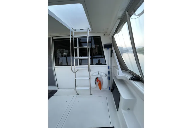 Slide: The Image of 2008 Meridian 490 Pilothouse interior with ladder and window view. - 43
