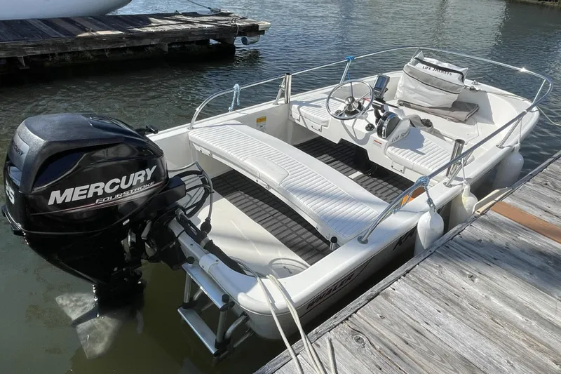 Slide: The Image of 2008 Meridian 490 Pilothouse boat with Mercury outboard motor docked at marina. - 51