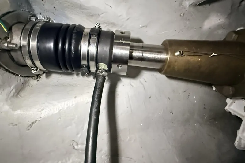 Slide: The Image of Close-up of a 2008 Meridian 490 Pilothouse boat shaft and coupling system. - 52