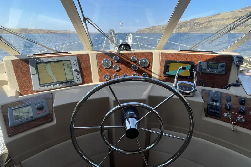 Slide: The Image of Pilothouse of 2008 Meridian 490 yacht with navigation instruments and steering wheel. - 56